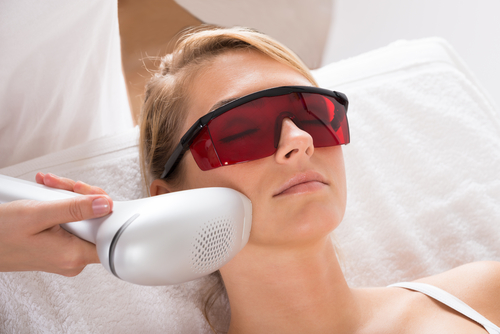 young woman undergoing laser treatment at salon-img-blog