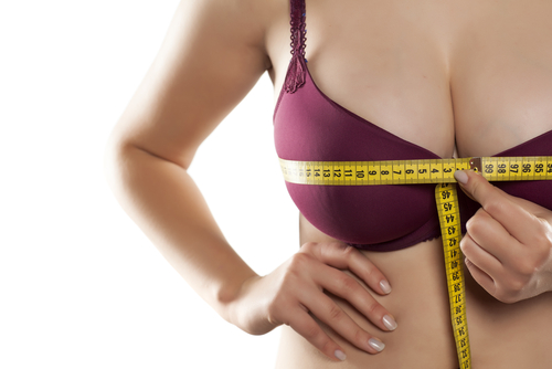 woman measured her huge breast with a measuring tape-img-blog