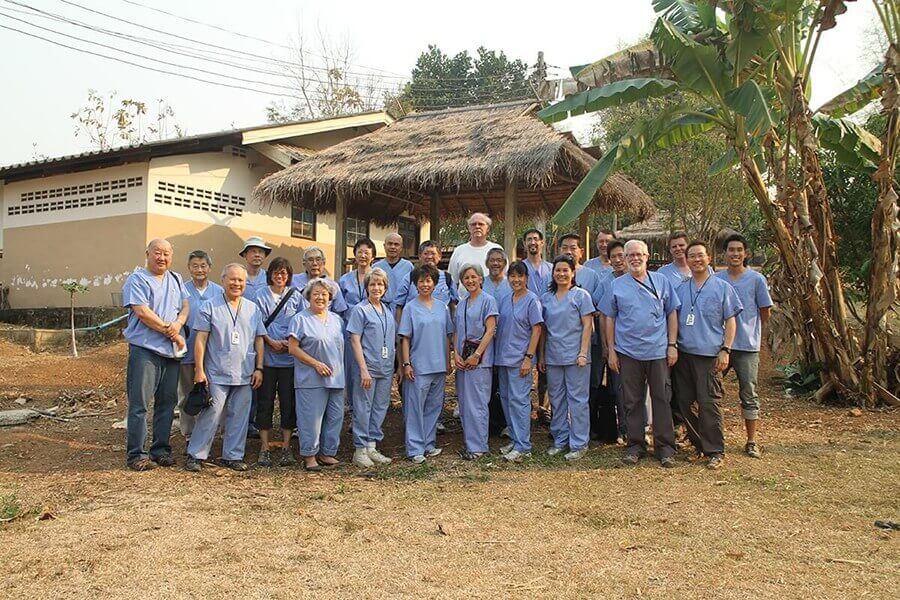 Mission Team In front of a hut