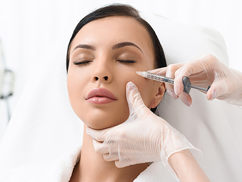 Beautiful woman getting an injection