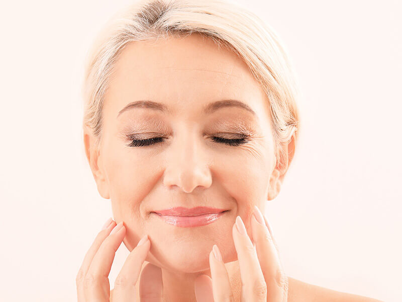 mature woman with eyes closed